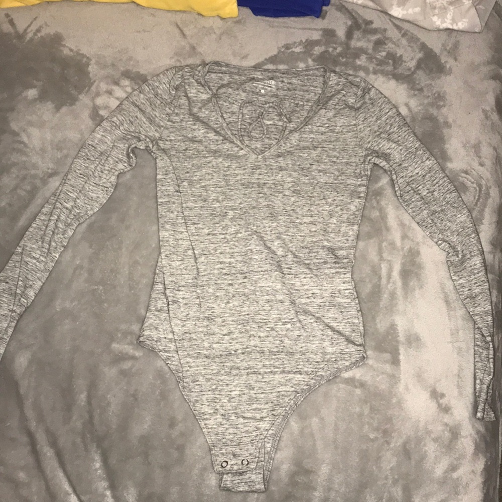 Long sleeved grey body suit